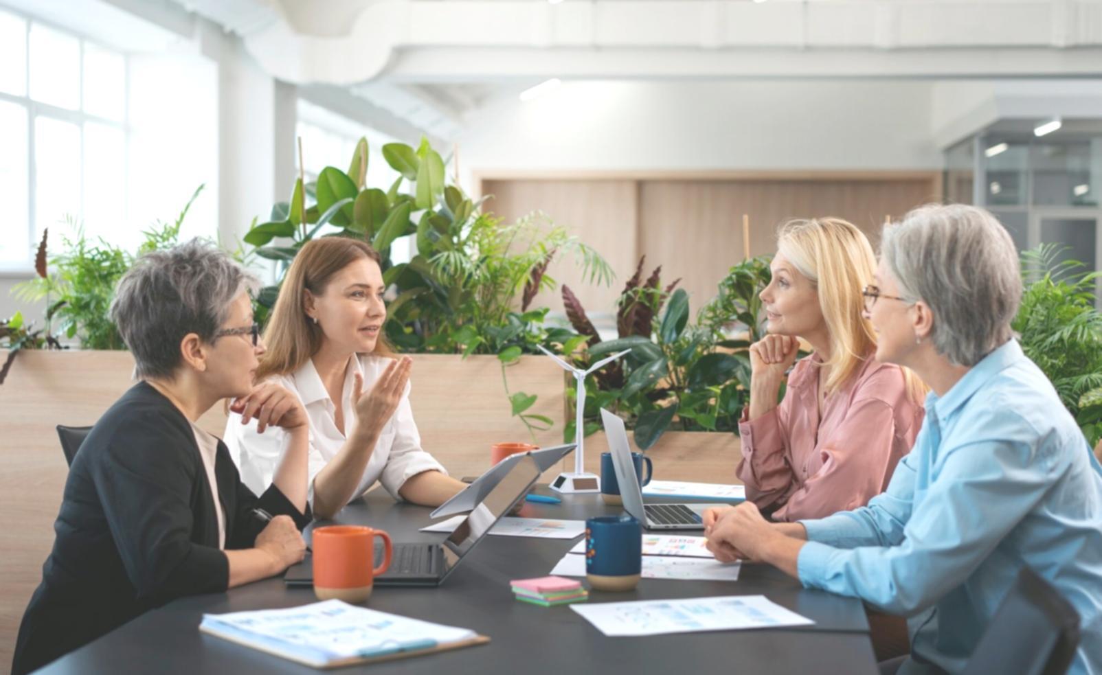 Finance professionals collaborating on profitability analysis during workshop session
